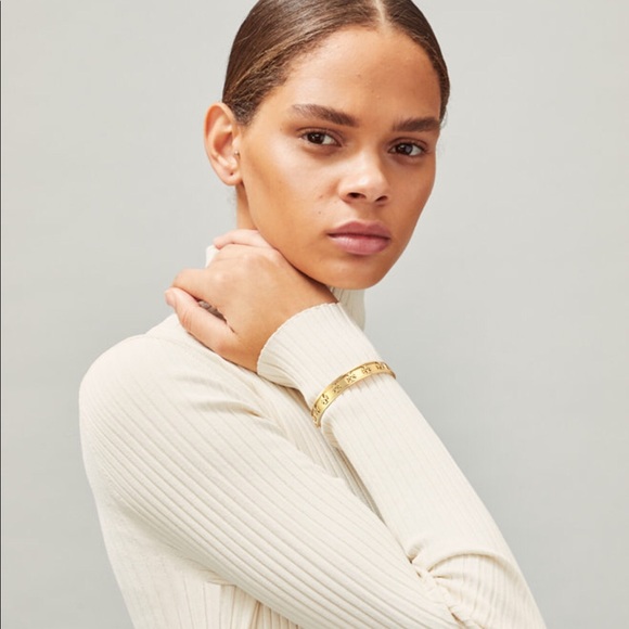TORY BURCH • Gold Raised Logo Cuff Bracelet - Picture 2 of 5